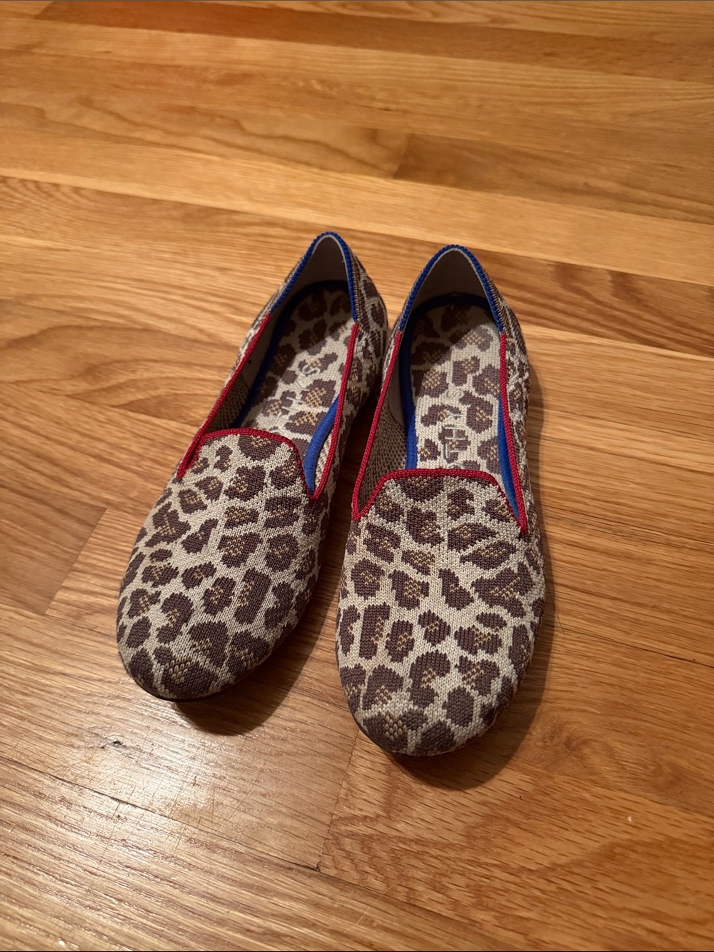 Rothy's Leopard Print Slip-On Flats with Red Trim and Blue Accents